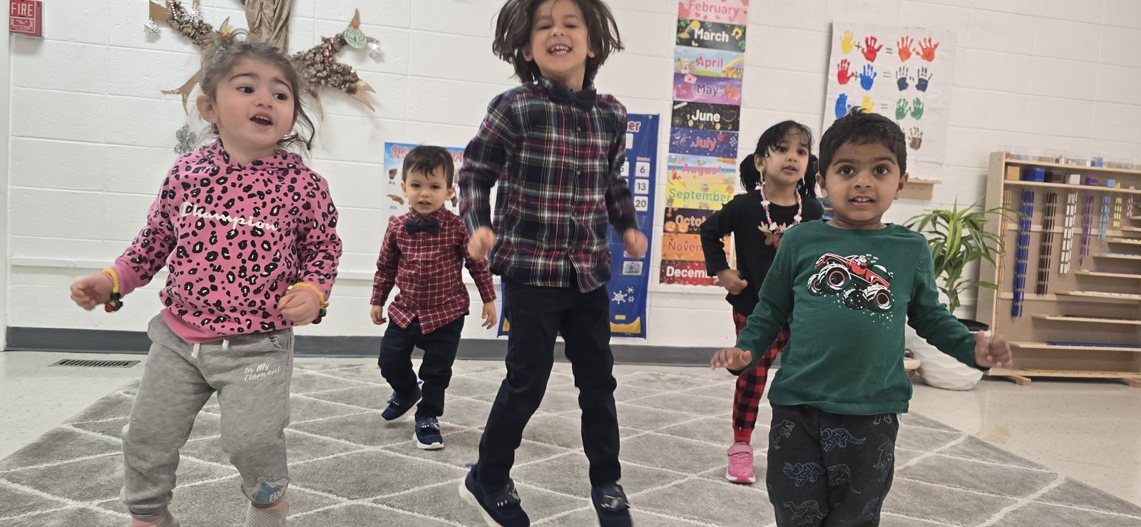 Children jumping and dancing with joy at Milestones summer camp