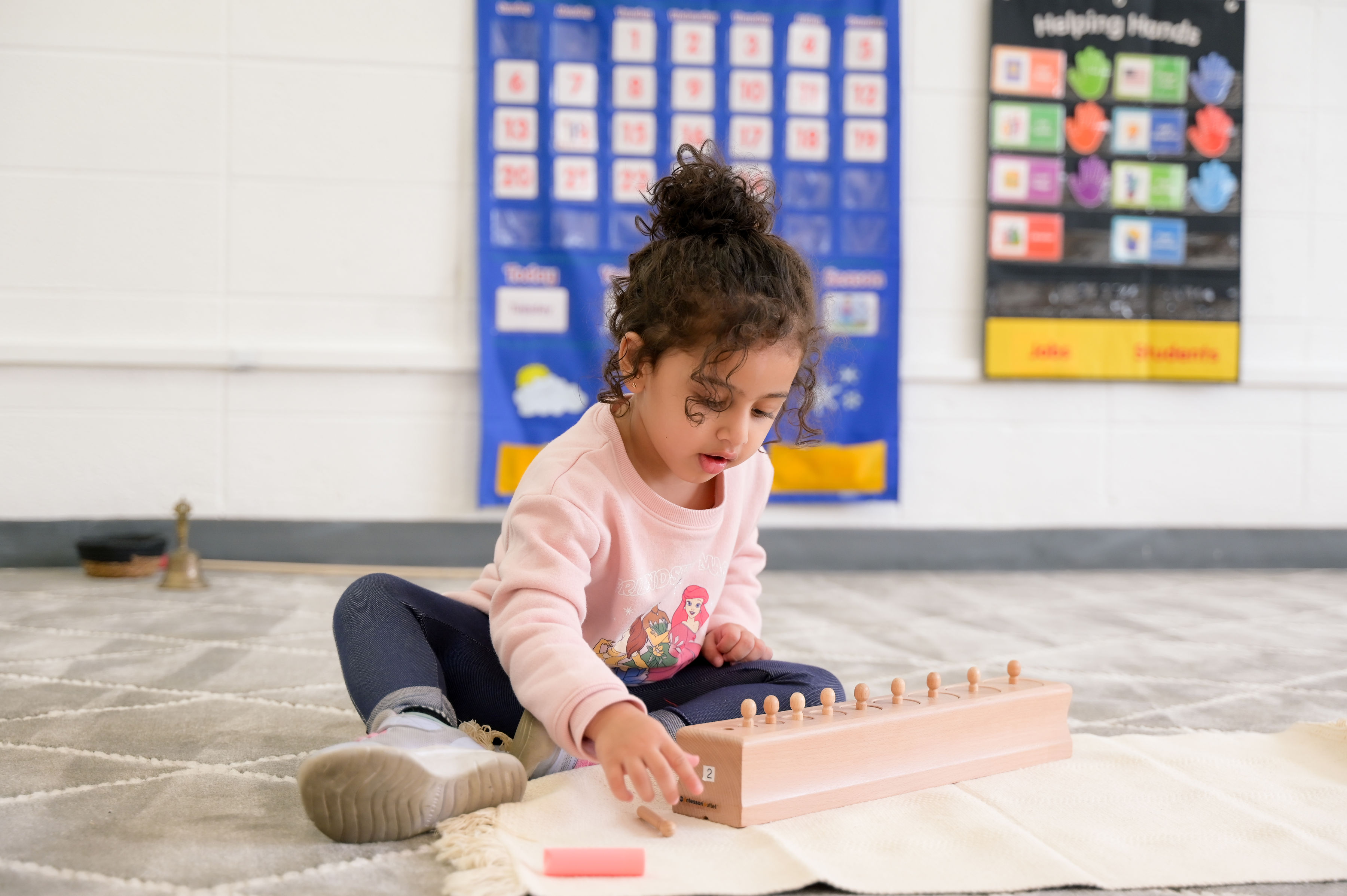 Child working on logic and patterns at Milestones Montessori