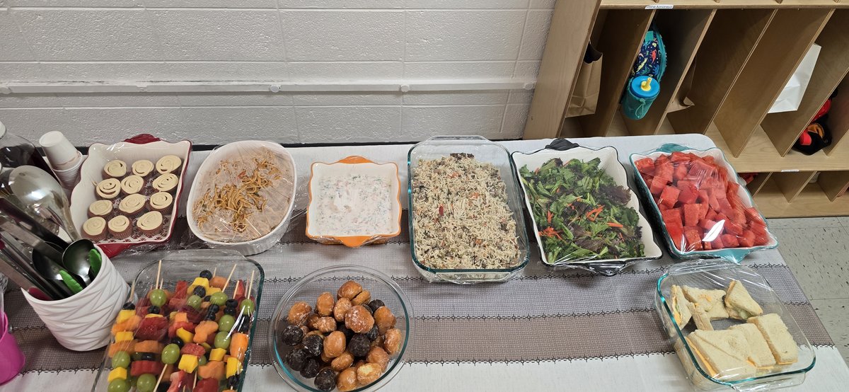 Community gathering food table at Milestones Montessori