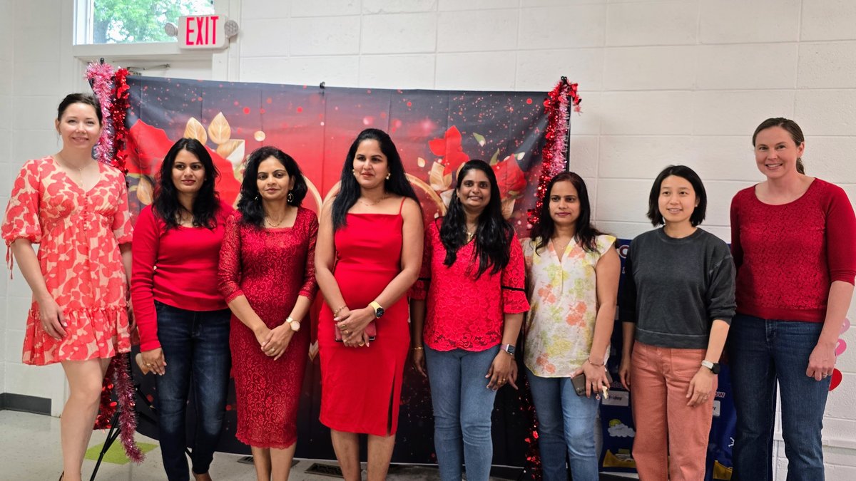 Children and families enjoying a sunny outdoor school event