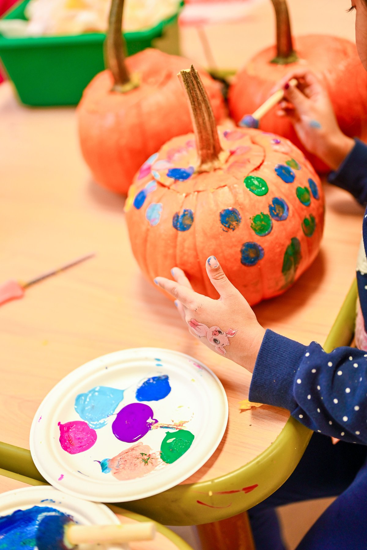 Children in colorful Halloween costumes at Milestones celebration