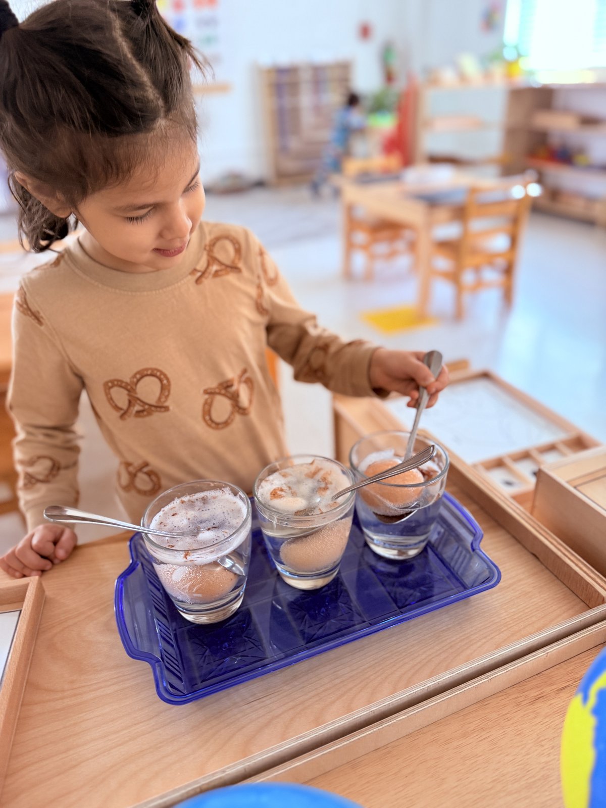 Child working on a number and math Montessori activity