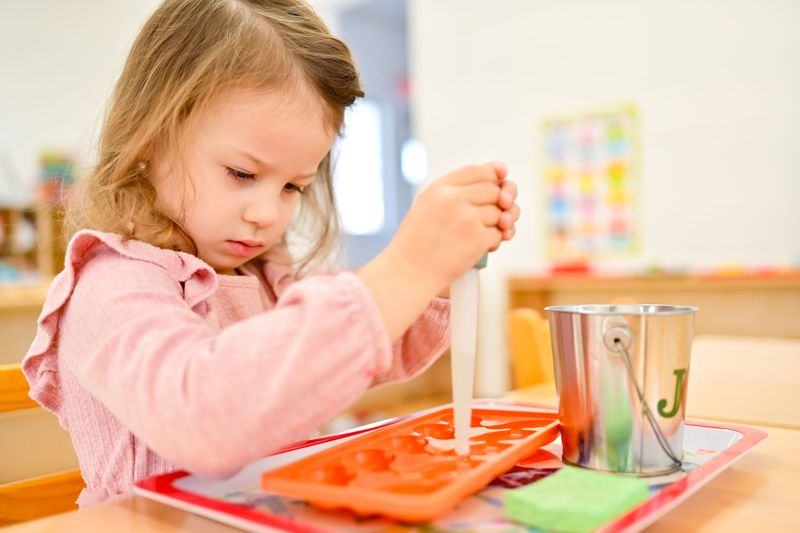 Toddler doing practical life activity